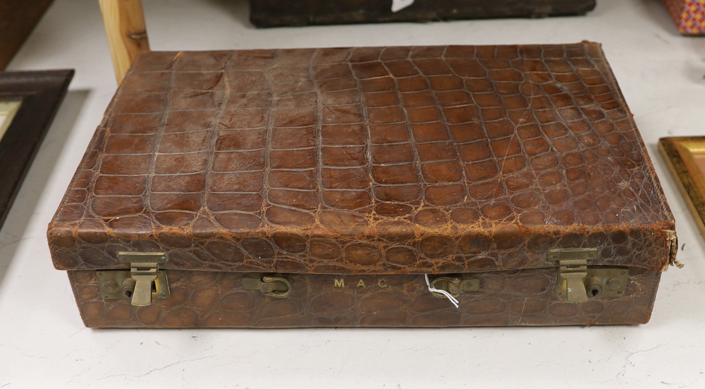 A Finnigans crocodile leather attaché case, pre 1940, with interior figments and blotter, 45cm wide, 28cm deep